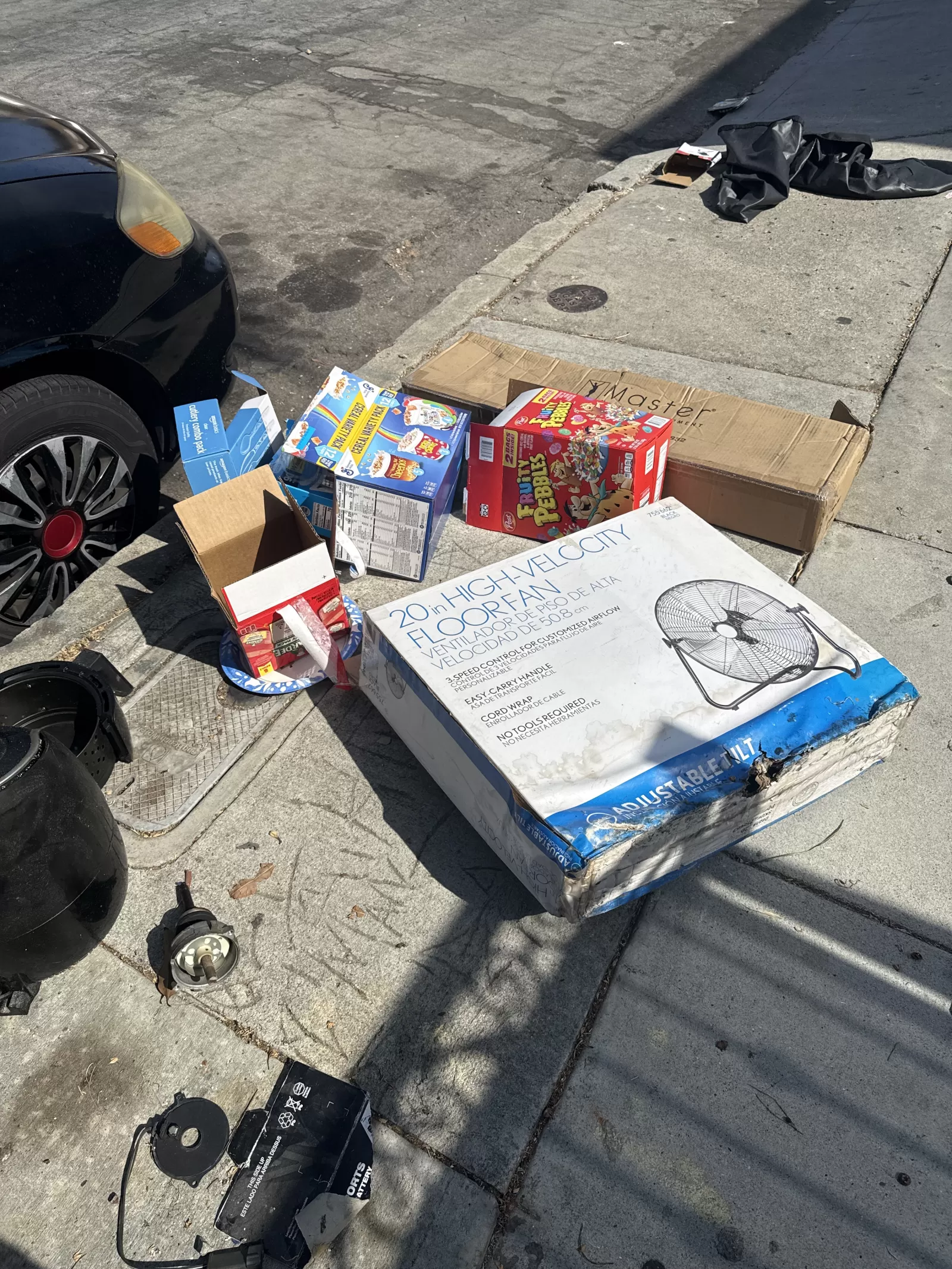 boxes of trash on sidewalk